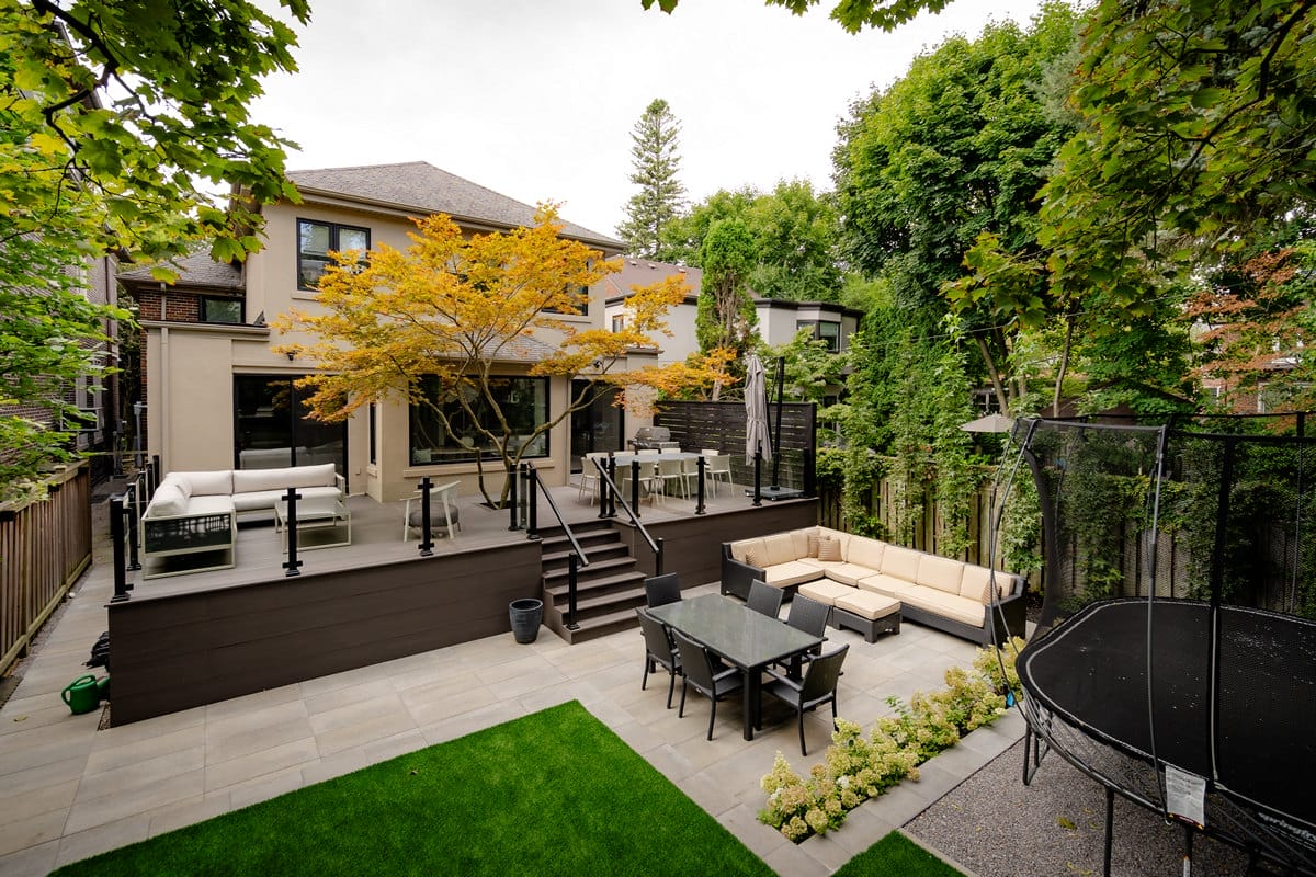 Glenayr Rd, Toronto, landscaping project featuring composite deck, sandstone patio and turf installation by M.E. contracting