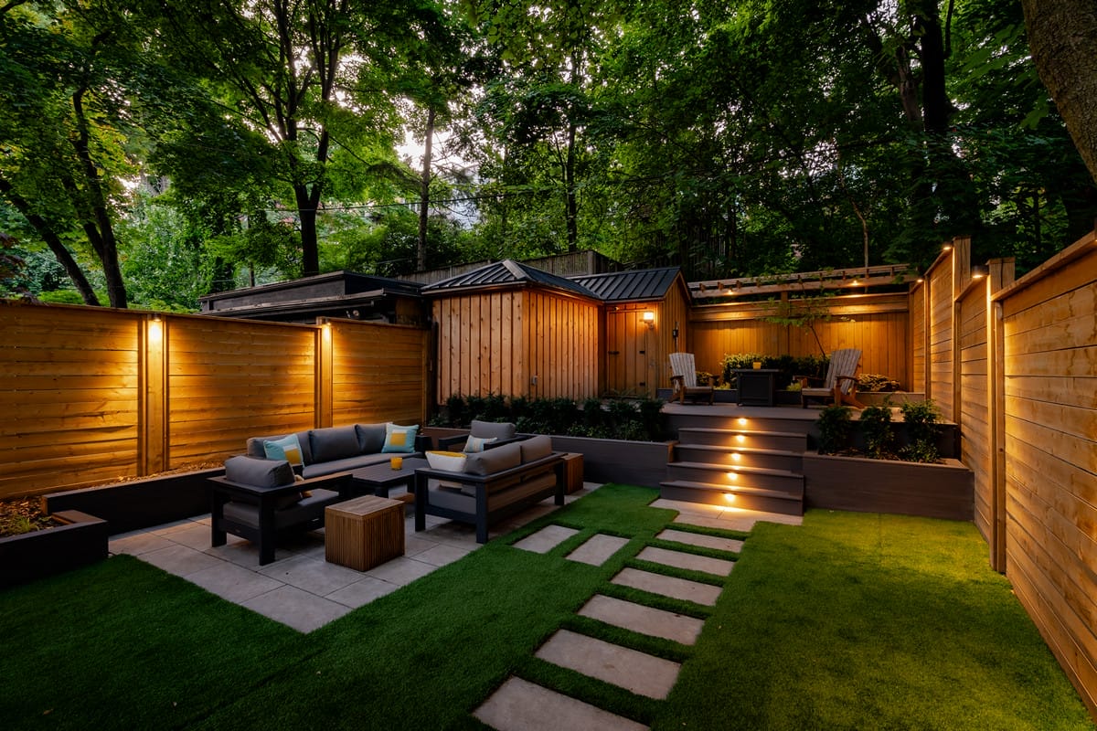 Walker Ave, Toronto landscaping project featuring raised composite deck, new fence installation, shed and patio build by M.E. contracting