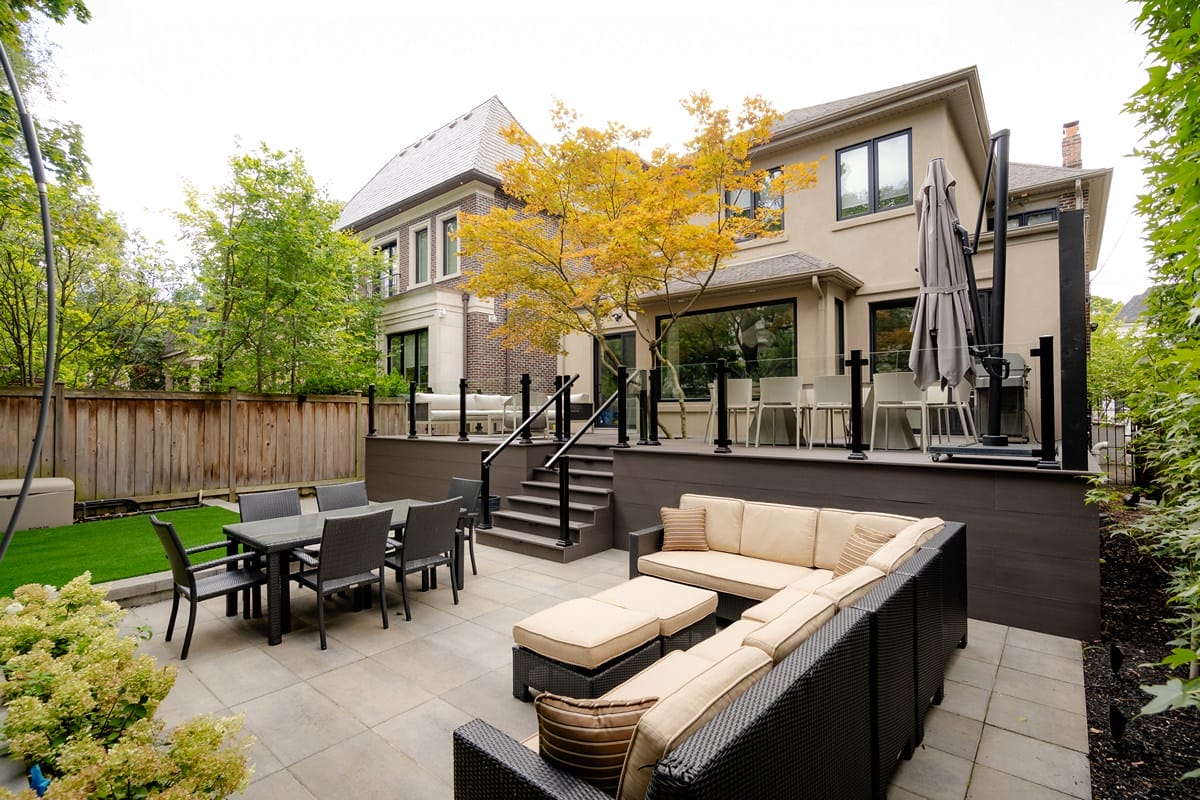 Glenayr Rd, Toronto, landscaping project featuring composite deck build over sandstone patio