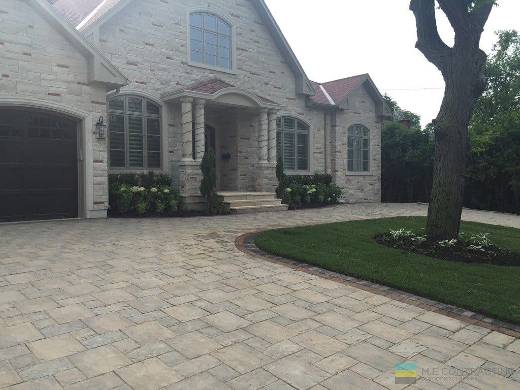 Landscaping project with heated driveway, interlocking and stone steps