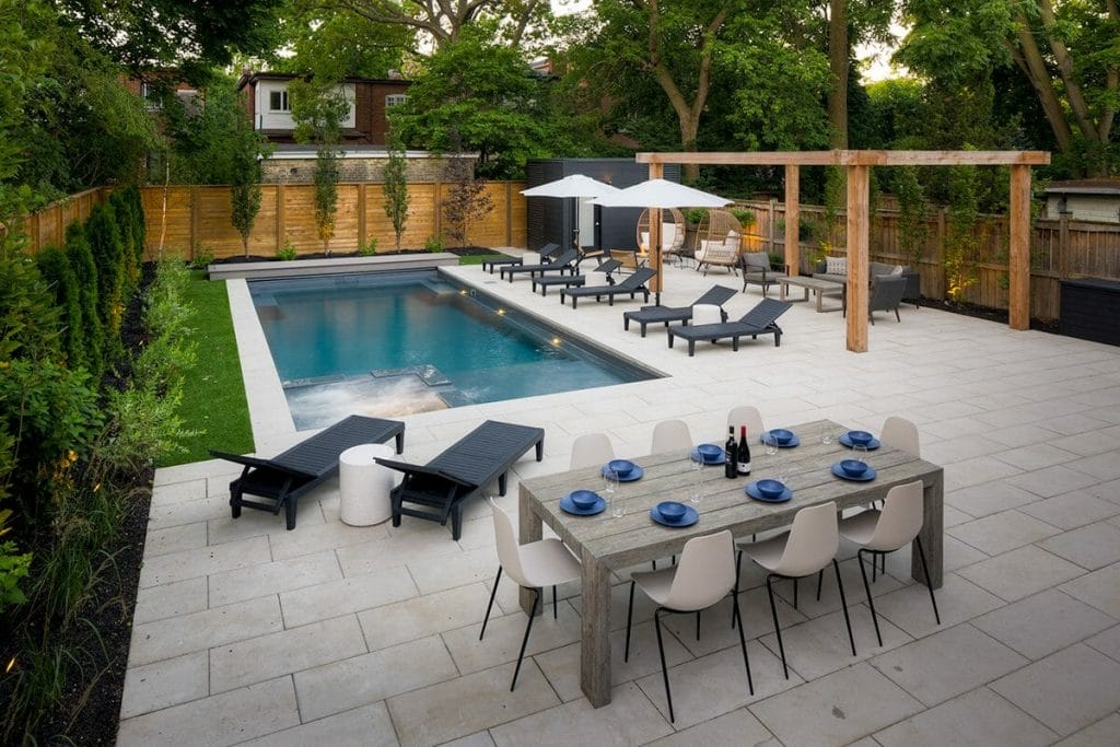 M.E. Contracting Completed Backyard Landscape Design Project; Featuring, Fiberglass Pool with Swim Spa, Stone Interlocking, Woodworking Pergola, And An Outdoor Fireplace