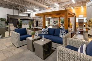 Side Profile of the Landscaping Showroom, Featuring Outdoor Lounge Furniture Wicker Outdoor Furniture Lounge Set with Wooden Pergola Offered by M.E. Contracting.