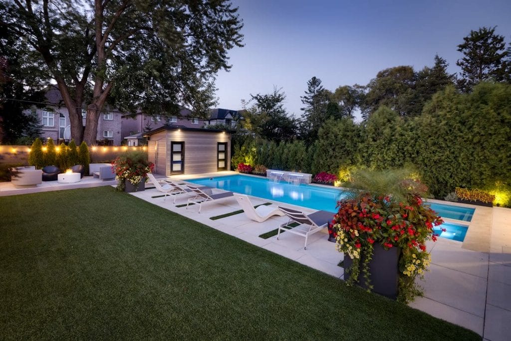 M.E. Contracting, Toronto Backyard Landscape Design and Construction Project Featuring, Pool Installation with Water Feature and Swim Spa, Stone Patio Interlocking, Woodworking Cabana, and Outdoor Fireplace