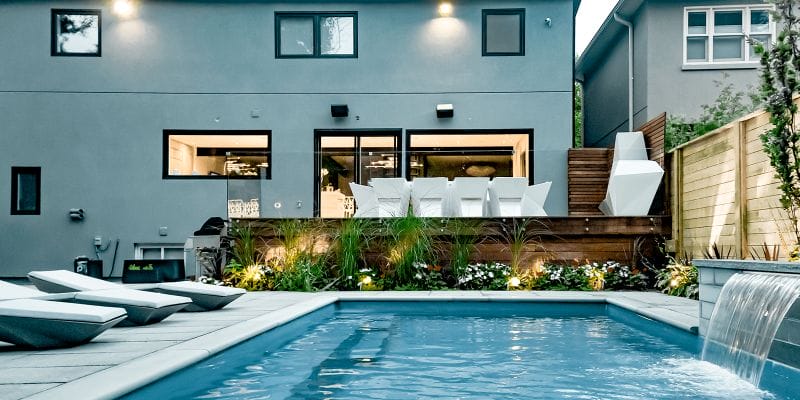 Sekler Residence, Toronto Backyard Landscape Design and construction Project with Fiberglass Pool Installation and Water Feature, Interlocking, Cedar Fence, Composite Decking, Frameless Glass Railings & Interlocking
