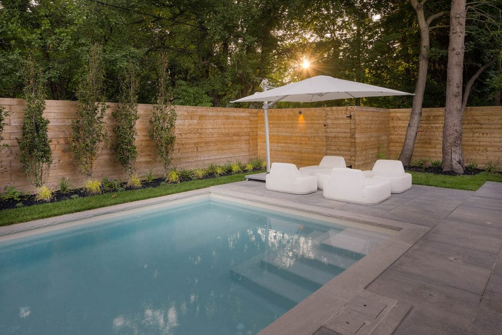 Toronto Landscape Design with Concrete Pool & Privacy Fence Installation by M.E. Contracting