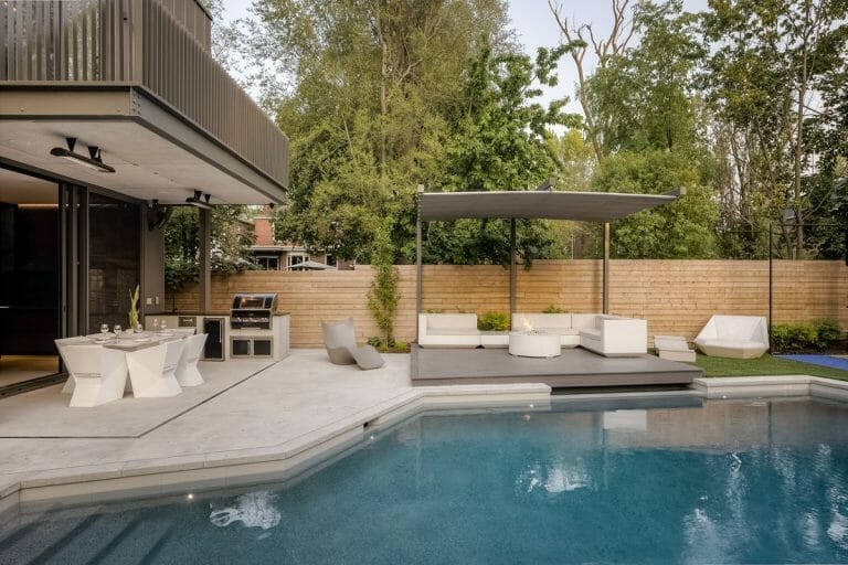 North York Backyard Pool construction Project with Water Features, Metal Pergola installation with Outdoor Fireplace, pool side landscaping and Outdoor Kitchen Area