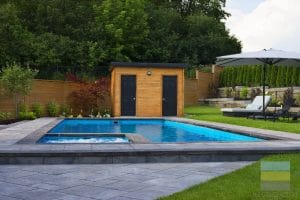 Toronto backyard Landscaping project featuring fiberglass pool and pool side patio construction