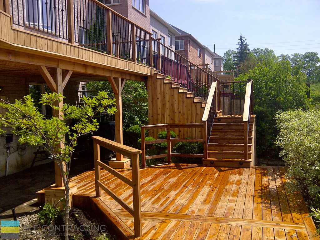 Deck construction project with two level cedar Decking by M.E. Contracting