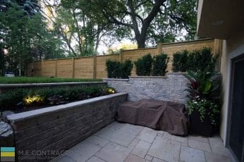 M.E. Contracting landscaping project that includes a retaining walls, fencing and interlocking