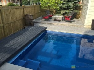 Pool with PVC walkway, interlocking patio and landscaping